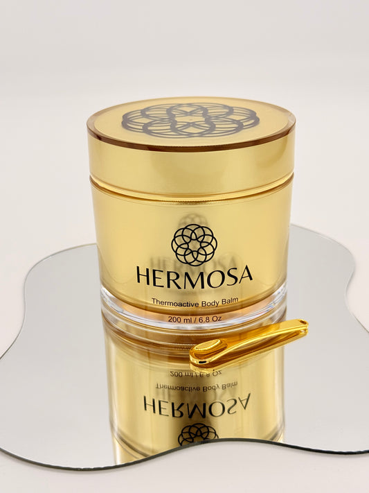 Hermosa Thermoactive Balm - opakowanie i złota łyżeczka, codzienny rytuał